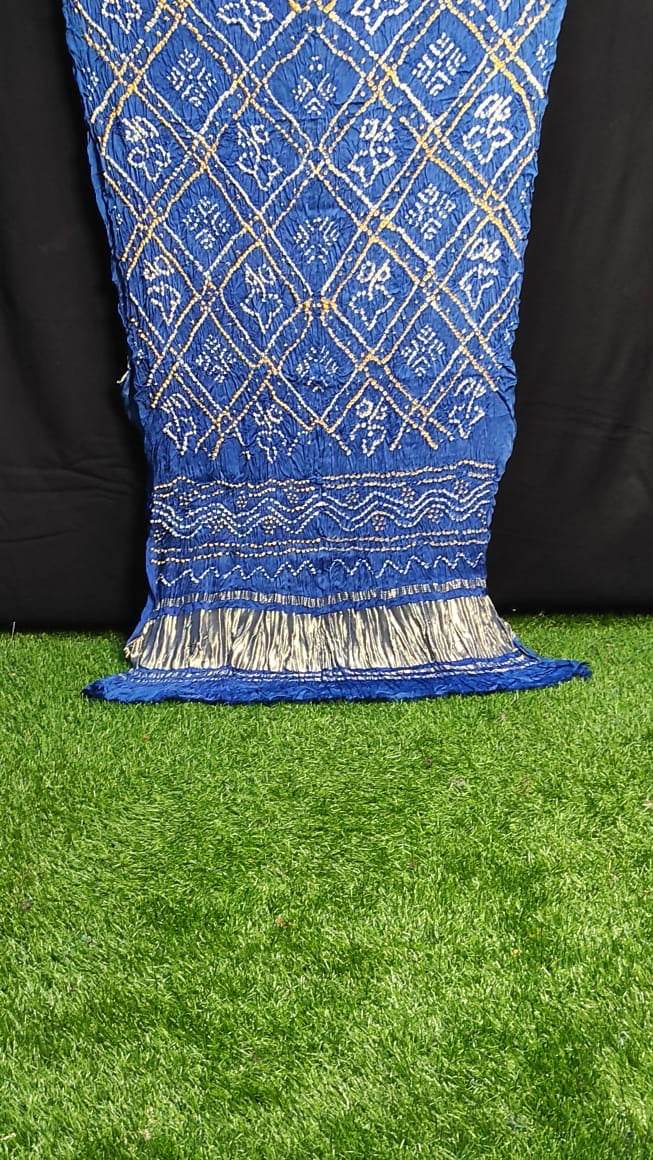 Blue Women Dupatta Gajji Silk with traditional gold thread embroidery and silver tassels on green grass background