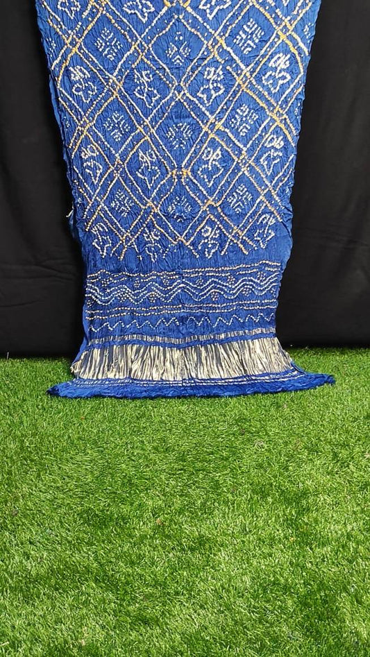 Blue Women Dupatta Gajji Silk with traditional gold thread embroidery and silver tassels on green grass background